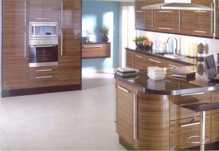 The Apollo Dark Walnut Gloss kitchen design is available from Gee's Kitchens, Bedrooms & Flooring of Kildare.